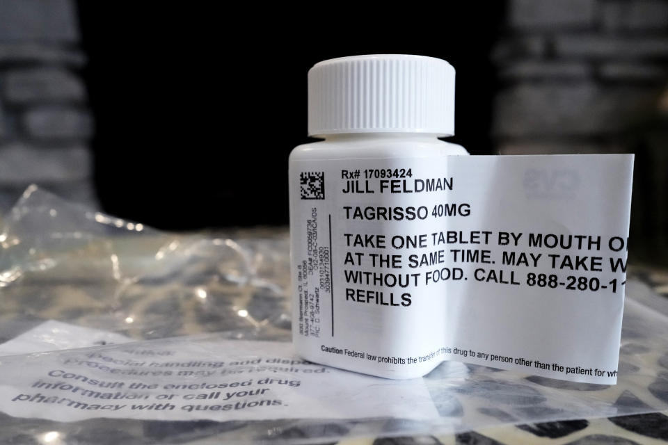 A prescription bottle called osimertinib (brand name: Tagrisso) is seen on a table at Jill Feldman's home in Deerfield, Illinois, Friday, January 19, 2024. Lung cancer patient and advocate Jill Feldman takes pills at home that shrink tumors by blocking tumors.  a signal that tells cancer cells to grow.  (AP Photo/Name Y. Huh)