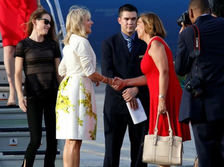 Jill Biden (2nd L), wife of U.S. Vice President Joe Biden and Josefina Vidal, director of U.S. affairs at the Cuban foreign ministry, shake hands upon Biden's arrival at Jose Marti airport in Havana, Cuba October 6, 2016. REUTERS/Stringer