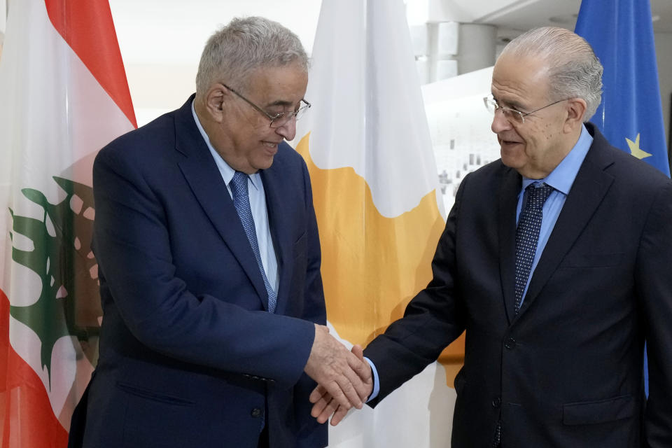 Cyprus' foreign minister Ioannis Kasoulides, right, shakes hands with his Lebanese counterpart Abdallah Bou Habib before their meeting at the foreign ministry house in Nicosia, Cyprus, Friday, April 15, 2022. Bou Habib is in Cyprus for one-day visit. (AP Photo/Petros Karadjias)