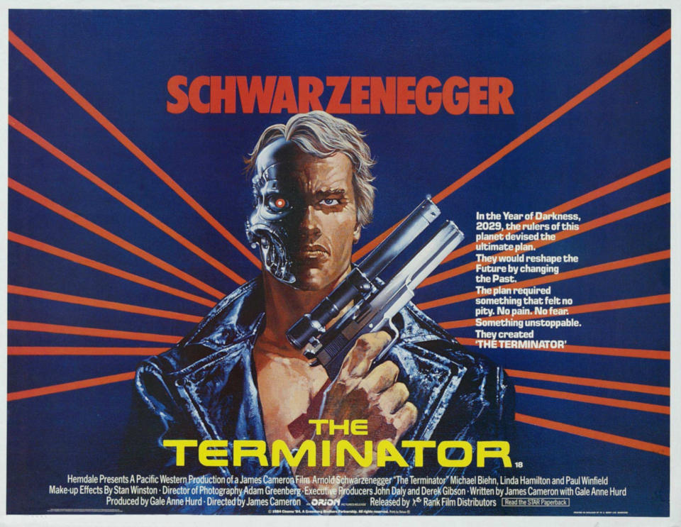 Movie poster of "The Terminator" featuring a character holding a gun, with futuristic text and graphics