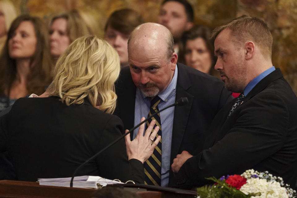 Rep. Matt Bradford, D-Montgomery, center, and Republican Rep. Bryan Cutler, right, talk to aides as legislators of the Pennsylvania House of Representatives are sworn-in, Tuesday, Jan. 3, 2023, at the state Capitol in Harrisburg, Pa. The ceremony marks the convening of the 2023-2024 legislative session of the General Assembly of Pennsylvania. (AP Photo/Matt Smith)