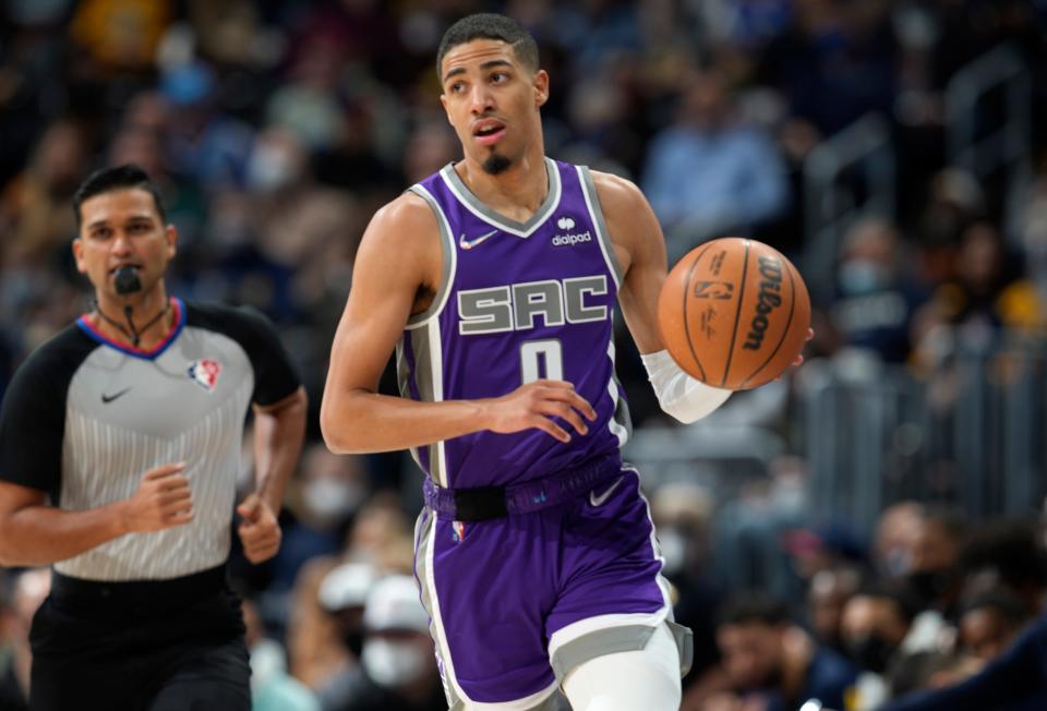 Sacramento Kings guard Tyrese Haliburton brings the ball up during the first half of the team's NBA basketball game against Denver Nuggets on Friday, Jan. 7, 2022, in Denver. (AP Photo/David Zalubowski)