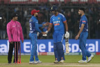 Afghanistans player greet India's Shivam Dube, centre, at the end of the second T20 cricket match between India and Afghanistan in Indore, India, Sunday, Jan. 14, 2024. (AP Photo/ Rajanish Kakade)