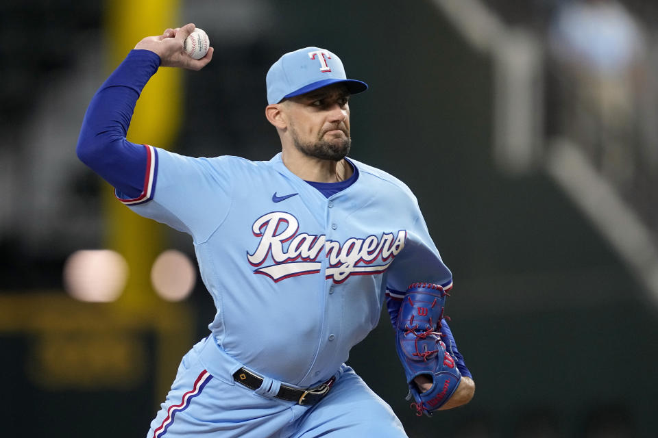 Texas Rangers starting pitcher Nathan Eovaldi throws to the Seattle Mariners in the first inning of a baseball game, Sunday, Sept. 24, 2023, in Arlington, Texas. (AP Photo/Tony Gutierrez)