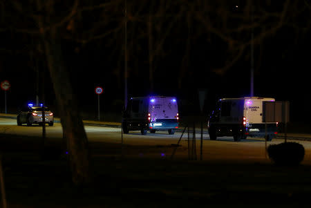 Police vans, believed to carry Catalan separatist politicians, leave prison on their to way to the Supreme Court in Soto del Real, Spain, February 12, 2019. REUTERS/Juan Medina