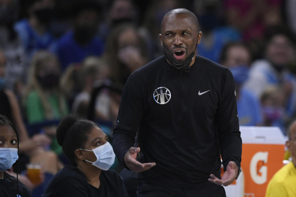Chicago Sky head coach James Wade argues with the referees during the first half of Game 3 of a WNBA semifinal playoff basketball game against the Connecticut Sun, Sunday, Oct. 3, 2021, in Chicago. Chicago won 86-83. (AP Photo/Paul Beaty)