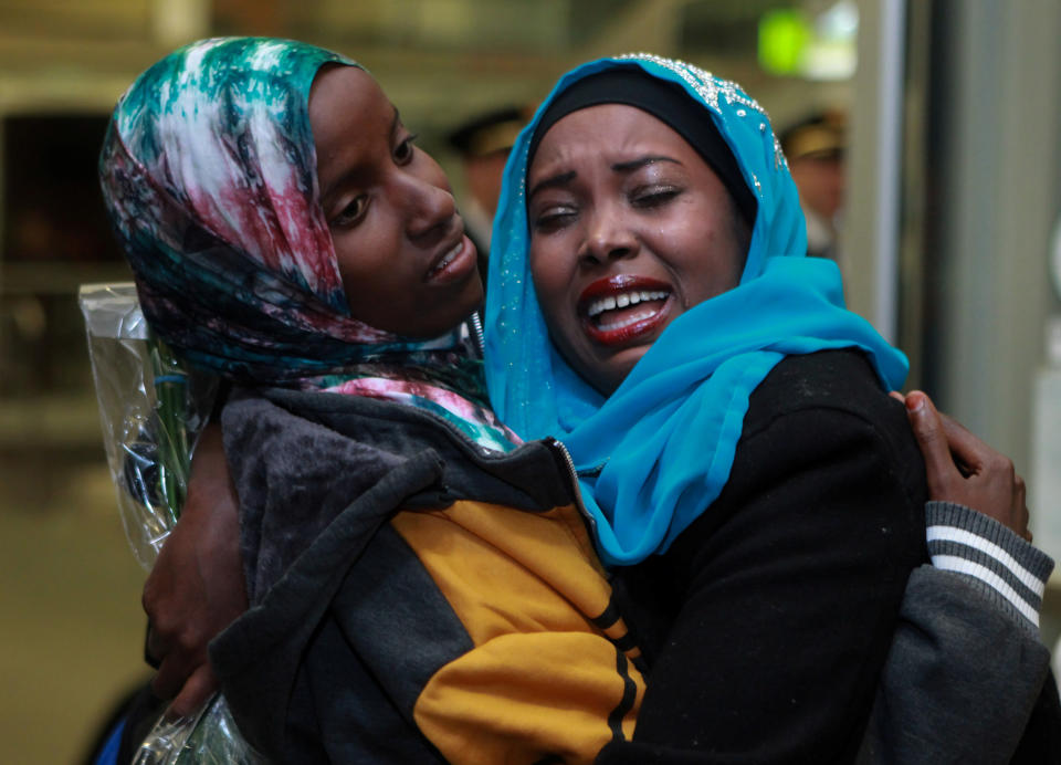 Dahaba Matan (left), a refugee from Somalia,&nbsp;greets her&nbsp;American family members upon arrival at the airport in Boise, Idaho, last March. (Photo: Brian Losness / Reuters)