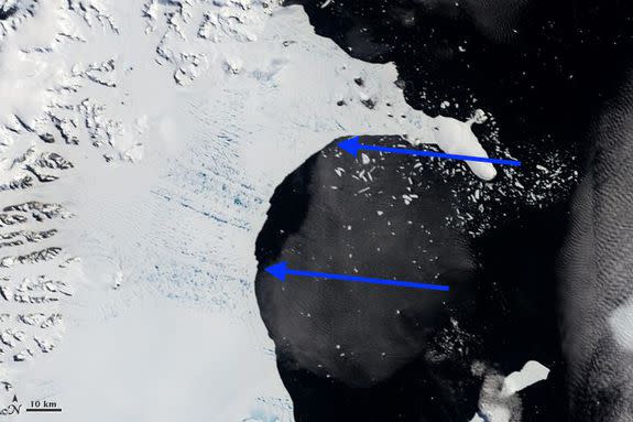 Larsen B Ice Shelf seen on Jan. 31, 2002, with arrows pointing to the edge of ice shelf.