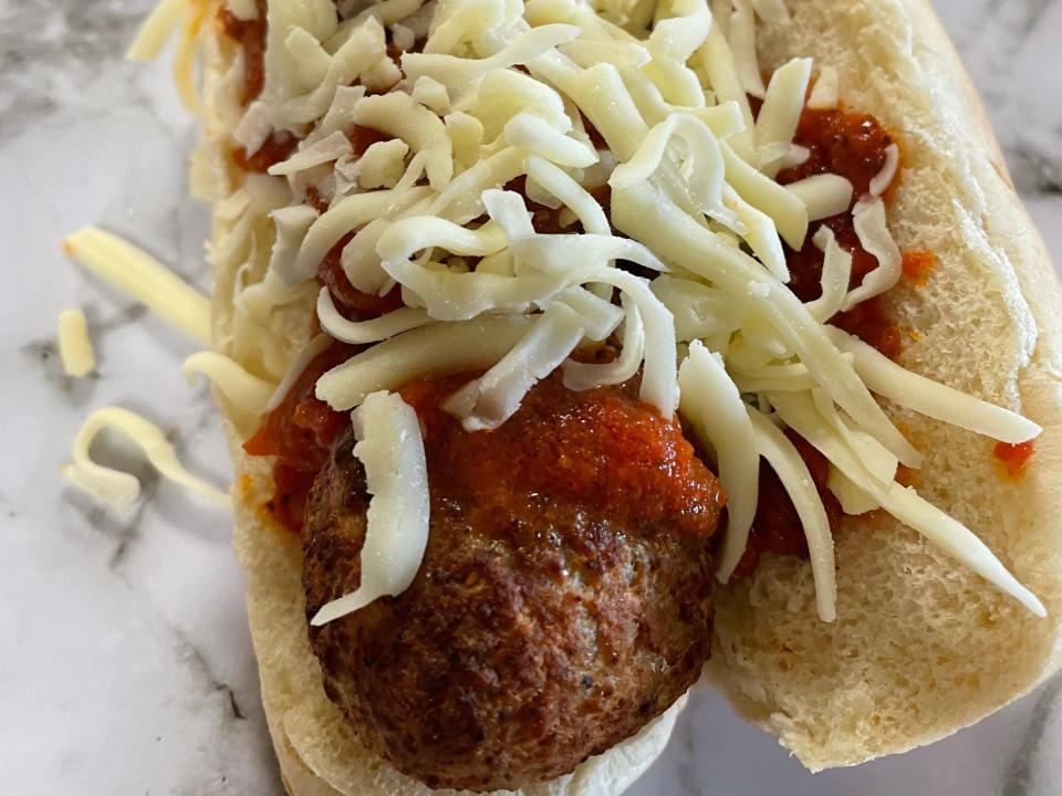 meatball sub made with trader joe's turkey meatballs and shredded cheese