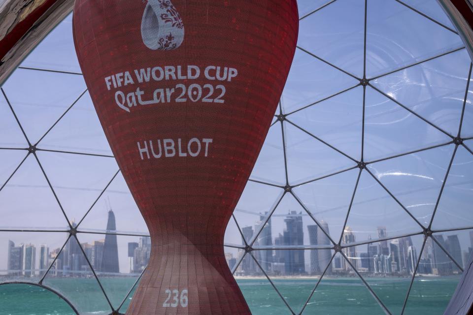 FILE - A count down clock is displayed at the seafront in Doha, Qatar, Tuesday, March 29, 2022. Qatar's residents squeezed as World Cup rental demand soars. (AP Photo/Darko Bandic, File)