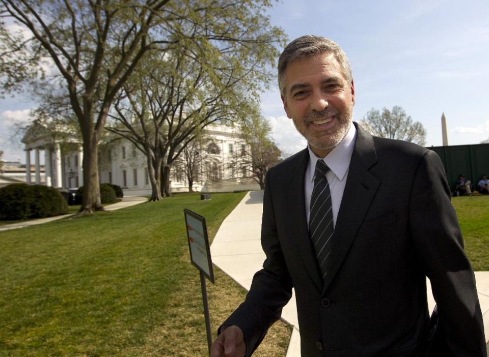 FILE - In this March 15, 2012 file photo, actor George Clooney leaves the White House in Washington. If you have $40,000 to spend, President Barack Obama's campaign has a deal for you. Write a big check, and you'll get you a picture with the president and the chance to swap political strategy him _ all while enjoying a gourmet meal at the lavish home of a Hollywood celebrity or Wall Street tycoon. And if you're lucky, you might just end up with a plum post as a U.S. ambassador or an invitation to an exclusive White House state dinner. (AP Photo/Pablo Martinez Monsivais, File)