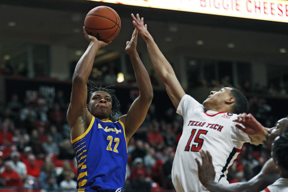 Cal State Bakersfield's Justin McCall (22) shoots the ball over Texas Tech's Kevin McCullar (15) during the first half of an NCAA college basketball game Sunday, Dec. 29, 2019, in Lubbock, Texas. (AP Photo/Brad Tollefson)