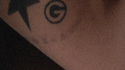 Skin, Tattoo, Arm, Temporary tattoo, Nose, Eye, Close-up, Hand, Flesh, Neck, 