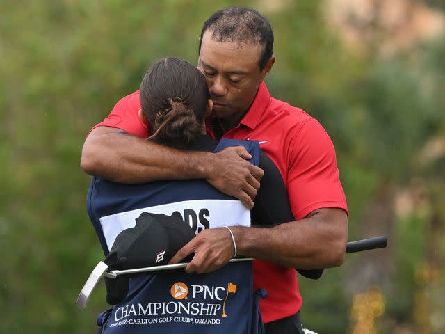 <p>Ben Jared/PGA TOUR/Getty</p> Tiger Woods and Sam Woods on the 18th green during the final round of the PNC Championship on December 17, 2023 in Orlando, Florida.