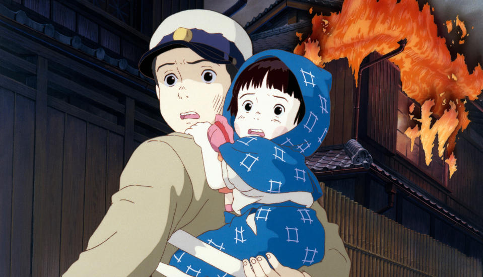 An animated boy carries a baby while the house behind them burns