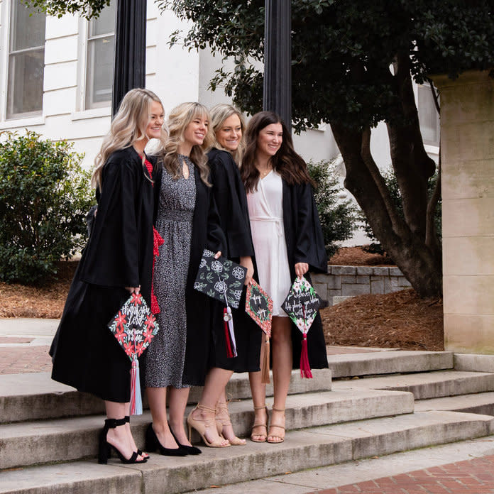 University of Georgia seniors (left to right) Aly Jones, Celeste Norton, Claudia Head, and Alexandria Hunt staged a graduation photo session on Monday, March 16th, UGA’s first day of a two-week suspension following spring break. The group was happy to have an empty campus for photos but collectively dismayed at the uncertainty of what graduation and their final days as UGA undergrads will look like. | Caroline Head