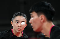 <p>Korea's Lee Sang-su (R) and Jeon Ji-hee compete against South Taiwan's Lin Yun-ju and Cheng I-ching during their mixed doubles quarterfinals table tennis match at the Tokyo Metropolitan Gymnasium during the Tokyo 2020 Olympic Games in Tokyo on July 25, 2021. (Photo by JUNG Yeon-je / AFP)</p> 