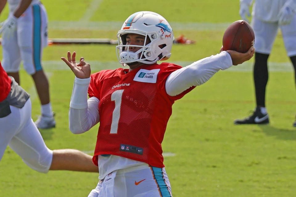 Miami Dolphins quarterback Tua Tagovailoa (1) throws the ball during an NFL football training camp practice in Davie, Fla., Monday, Aug. 17, 2020. (AP Photo/Joel Auerbach)