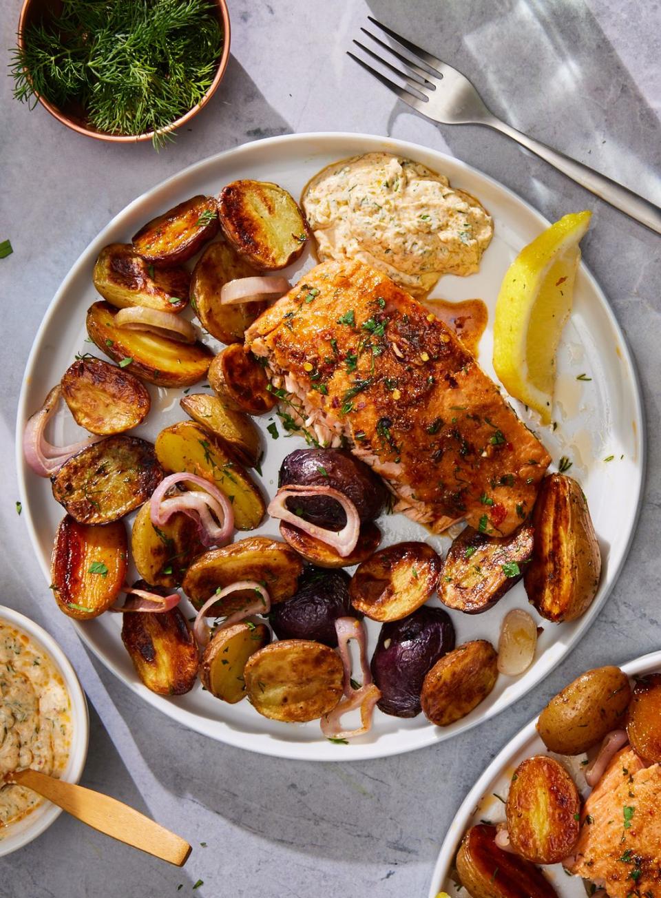 baked salmon potato skillet with shallots and dill yogurt sauce