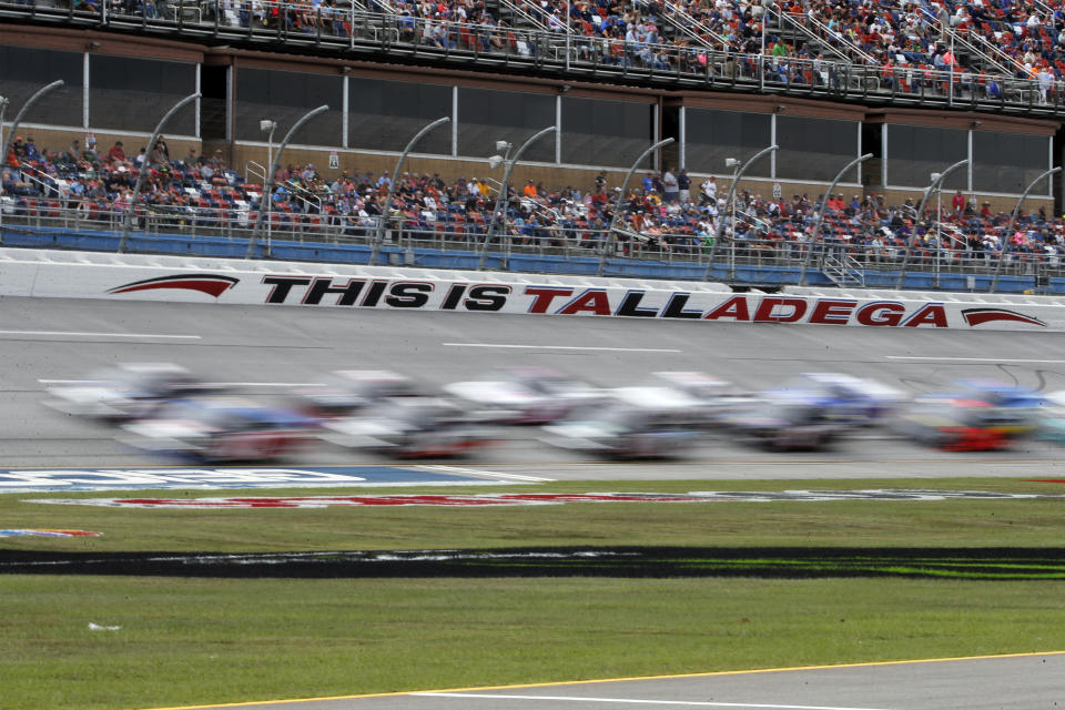 Trucks pass through the tai-oval during the Sugarlands Shine 250 at Talladega Superspeedway, Saturday, Oct 12, 2019, in Talladega, Ala. (AP Photo/Butch Dill)
