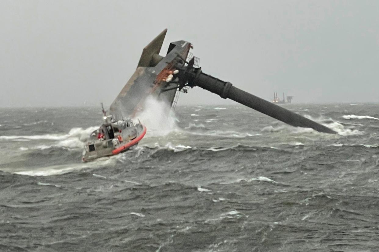 <p>A Coast Guard response boat heads toward a capsized 175-foot commercial lift boat  searching for people in the water 8 miles south of Grand Isle, Louisiana</p> (US Coast Guard Coast Guard Cutter Glenn Harris via AP)