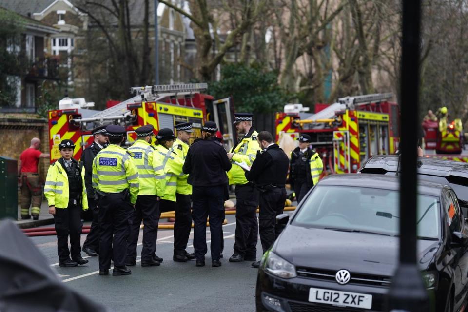 Fire engines and police officers on Seagrave Road in Fulham, west London, as firefighters tackle a blaze at London Oratory Schoo (James Manning/PA Wire)