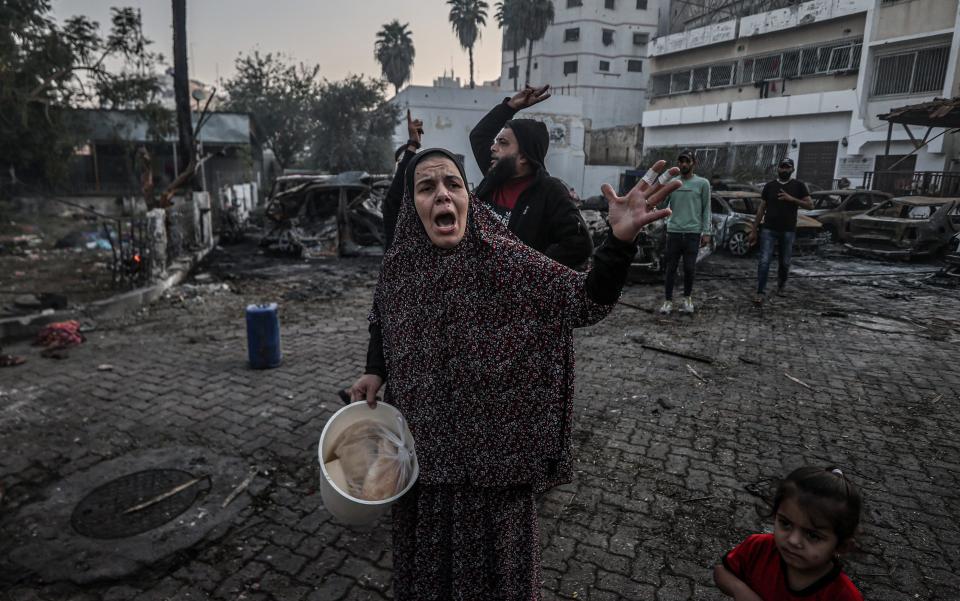 A woman reacts a day after Al-Ahli Baptist Hospital was hit in Gaza City.