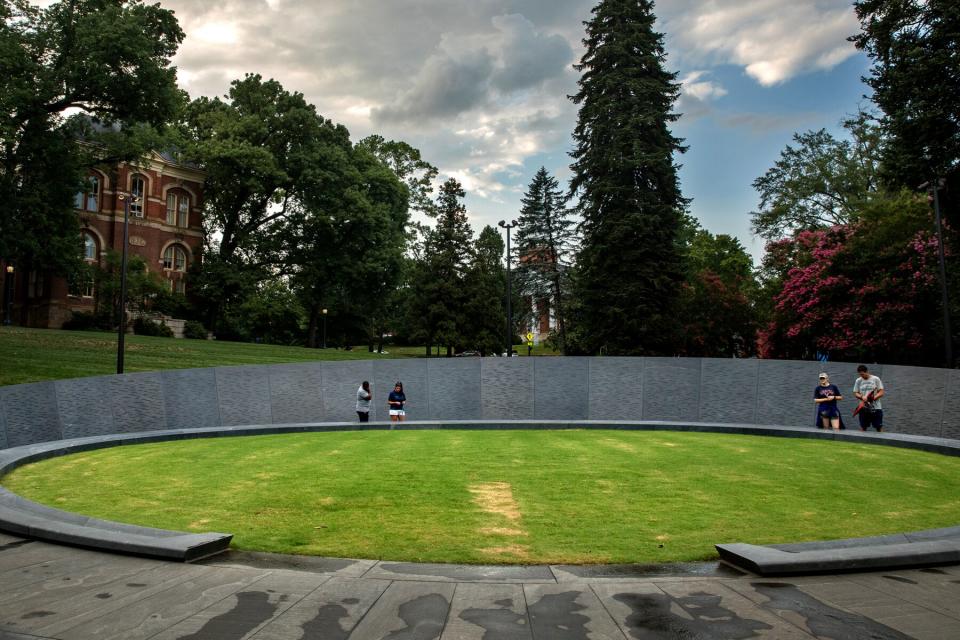 Visitors at the University of Virginias Memorial for Enslaved Laborers in Charlottesville, VA