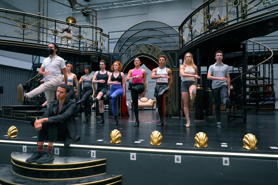 Director and choreographer Josh Rhodes (standing left), rehearses cast members from his production of “Cabaret” at Asolo Repertory Theatre.