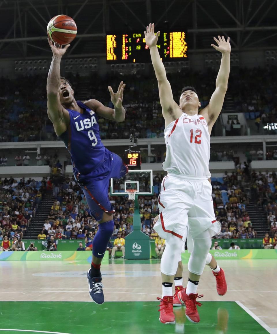<p>United States’ DeMar DeRozan (9) scores over China’s Li Gen (12) during a men’s basketball game at the 2016 Summer Olympics in Rio de Janeiro, Brazil, Saturday, Aug. 6, 2016. (AP Photo/Eric Gay) </p>