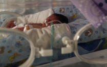 A newborn baby receives oxygen in an incubator in the intensive care unit of the Women's Hospital maternity ward in La Paz, Bolivia, Thursday, Aug. 13, 2020. Doctors say the supply of oxygen for the babies is becoming scarce, the result of nationwide blockades by supporters of the party of former President Evo Morales who object to the recent postponement of elections. Bolivia's political and social crisis is coinciding with the continued spread of the new coronavirus. (AP Photo/Juan Karita)
