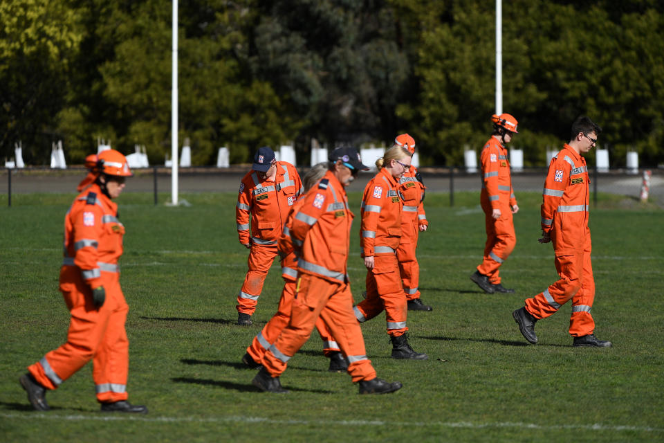 SES volunteers scour parklands for a weapon. Source: AAP