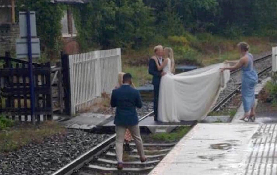 A couple kiss on a railway track near Whitby, North Yorkshire. (SWNS)