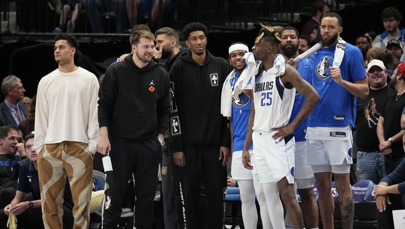 The Dallas Mavericks bench watches play against the Chicago Bulls on Friday, April 7, 2023, in Dallas.