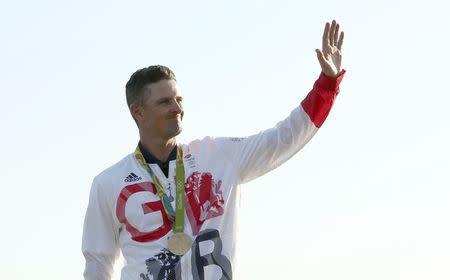 2016 Rio Olympics - Golf - Final - Men's Individual Stroke Play - Olympic Golf Course - Rio de Janeiro, Brazil - 14/08/2016. Justin Rose (GBR) of Britain celebrates his gold medal win in the men's Olympic golf compeititon. REUTERS/Andrew Boyers