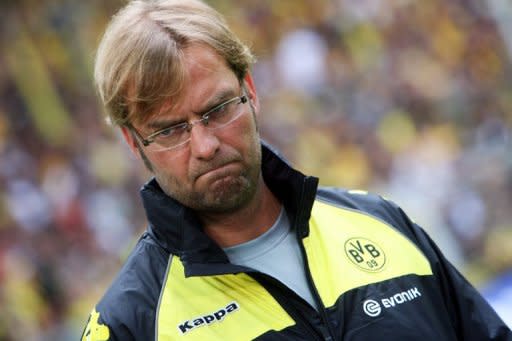 Borussia Dortmund coach Jurgen Klopp (pictured) has said he expects bitter rivals Schalke 04 to try and "spit in their soup" on Saturday with his team six points clear at the top of the league. Dortmund beat second-placed Bayern Munich 1-0 at their Signal Iduna Park stadium on Wednesday and victory leaves them clear at the top with four games left