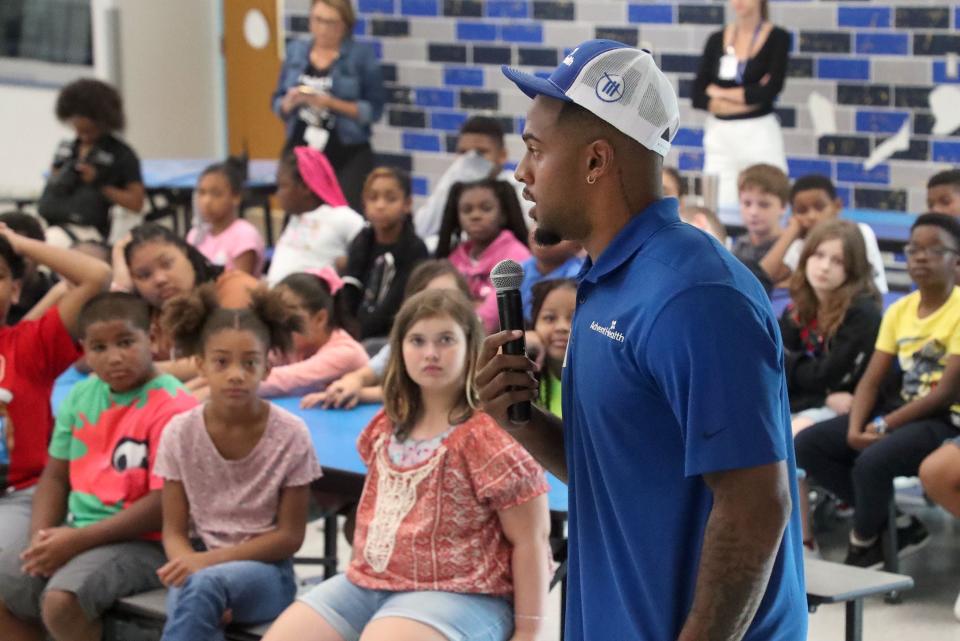 Journey Brown, right, has been on a wild ride, going from a star Penn State running back to a member of Spire Motorsports' pit crew. He's in Austin this week as part of Sunday's NASCAR Cup Series EchoPark Automotive Grand Prix race at Circuit of the Americas.