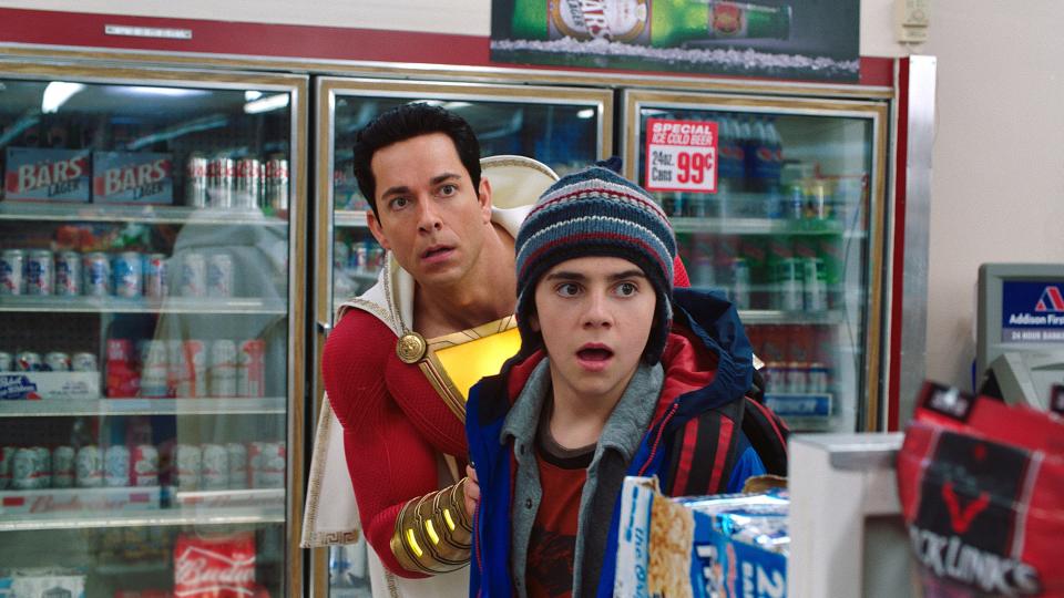 Super-sized Billy Batson (Zachary Levi, left) and Freddy Freeman (Jack Dylan Grazer) run into robbers on a mission to buy beer in "Shazam!"