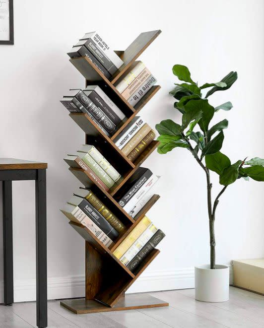 This eye-catching take on traditional shelves will really spruce up your reading nook.<br /><br /><strong>Promising review:</strong> "I love this bookshelf! <strong>It&rsquo;s a work of art!</strong> I have not yet fastened it to the wall as I hate to put more holes in the wall but may have to once I fill it up with more books. This is the cutest." &mdash; <a href="https://www.amazon.com/gp/customer-reviews/R2BRQHNAE4TI2M?&amp;linkCode=ll2&amp;tag=huffpost-bfsyndication-20&amp;linkId=57802f0f964212f78354c1247759da59&amp;language=en_US&amp;ref_=as_li_ss_tl" target="_blank" rel="nofollow noopener noreferrer" data-skimlinks-tracking="5854435" data-vars-affiliate="Amazon" data-vars-href="https://www.amazon.com/gp/customer-reviews/R2BRQHNAE4TI2M?tag=bfmal-20&amp;ascsubtag=5854435%2C6%2C37%2Cmobile_web%2C0%2C0%2C16331333" data-vars-keywords="cleaning,fast fashion" data-vars-link-id="16331333" data-vars-price="" data-vars-product-id="20945947" data-vars-product-img="" data-vars-product-title="" data-vars-retailers="Amazon">Amazon Customer<br /><br /></a><strong>Get it from Amazon for <a href="https://www.amazon.com/VASAGLE-Bookshelf-Standing-Bookcase-ULBC11BX/dp/B07PKP7SY9?&amp;linkCode=ll1&amp;tag=huffpost-bfsyndication-20&amp;linkId=f08ed4b8c28cb25a16fb936c2ff48b4f&amp;language=en_US&amp;ref_=as_li_ss_tl" target="_blank" rel="nofollow noopener noreferrer" data-skimlinks-tracking="5854435" data-vars-affiliate="Amazon" data-vars-asin="B07PKP7SY9" data-vars-href="https://www.amazon.com/dp/B07PKP7SY9?tag=bfmal-20&amp;ascsubtag=5854435%2C6%2C37%2Cmobile_web%2C0%2C0%2C16325635" data-vars-keywords="cleaning,fast fashion" data-vars-link-id="16325635" data-vars-price="" data-vars-product-id="18874181" data-vars-product-img="https://m.media-amazon.com/images/I/41hUsQ5c8nL.jpg" data-vars-product-title="VASAGLE Tree Bookshelf, 8-Tier Floor Standing Bookcase, with Wooden Shelves for Living Room, Home Office, Rustic Brown ULBC11BX" data-vars-retailers="Amazon">$63.99+</a> (available in three colors).</strong>