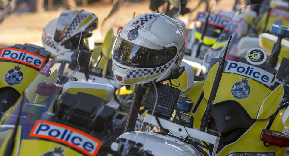 Lines of police motorcycles and helmets. Source: AAP