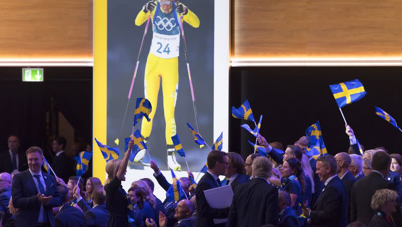 Stockholm-Are delegation members celebrate during a presentation to the International Olympic Committee at the SwissTech Convention Centre, in Lausanne, on June 24, 2019. A new poll commissioned found that nearly 7 out of 10 Swedes want to get into the race to host in 2030, a significant jump in the lackluster support shown for past bids.