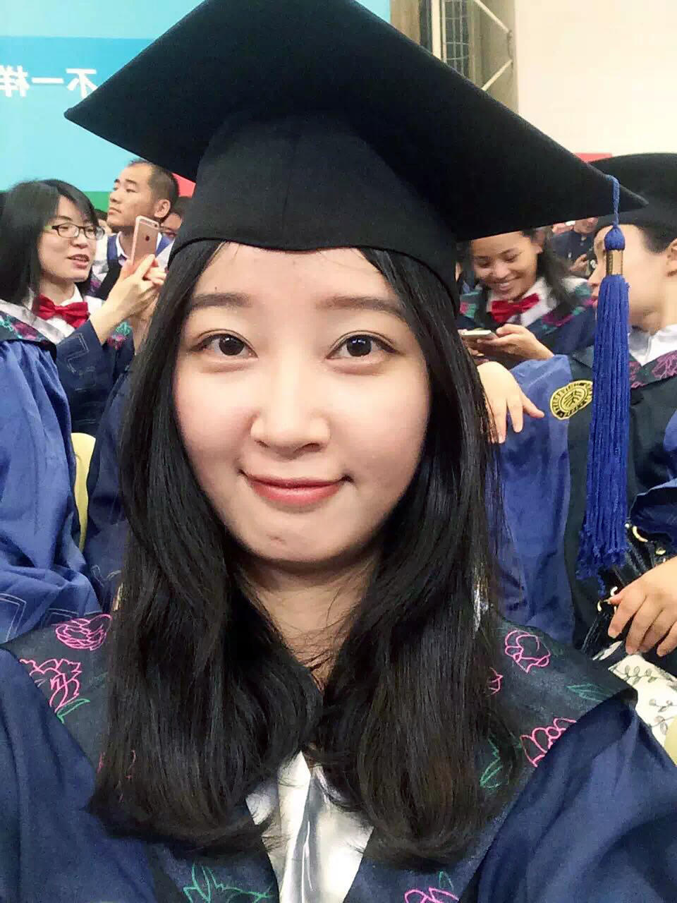 FILE - This 2016 selfie provided by her family shows Yingying Zhang in a cap and gown for her graduate degree in environmental engineering from Peking University Shenzhen Graduate School in China. Brendt Christensen's will serve a sentence of life in prison because a federal jury said Thursday, July 18, 2019, it could not unanimously agree he should receive the death penalty in the 2017 abduction, rape and killing of 26-year-old Yingying Zhang. (Zhang Family Photo via AP, File)