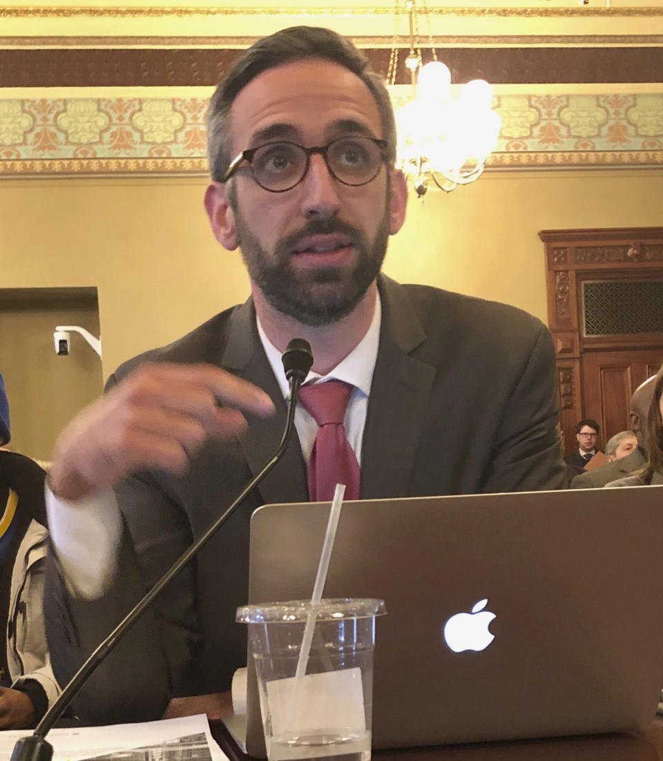 Illinois state Rep. Will Guzzardi, D-Chicago, testifies before the Labor and Commerce Committee Wednesday, Feb. 13, 2019 on his proposal to increase the minimum wage to $15 by 2025. (AP Photo/John O'Connor )