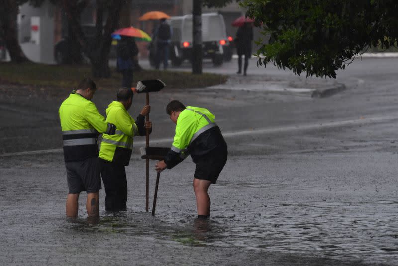 Council workers clear drain