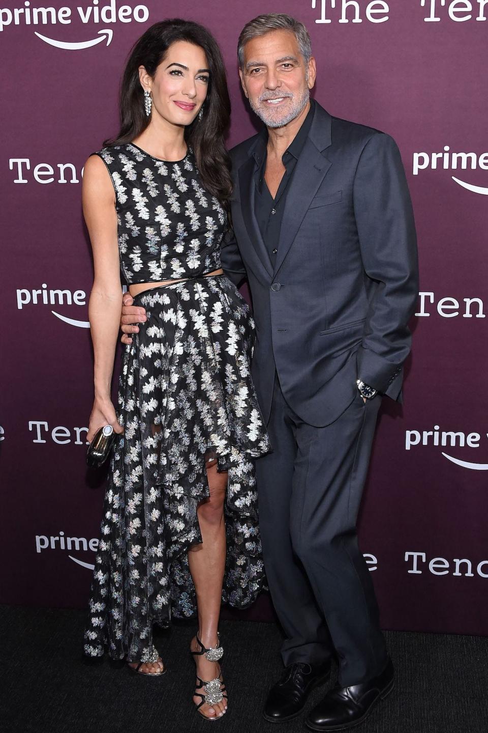 Amal Clooney and George Clooney at "The Tender Bar" premiere on October 3, 2021.