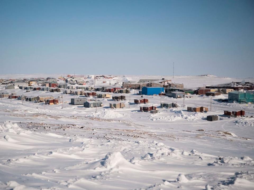 Schools in Sanikiluaq, Nunavut, will open to in-person learning on Monday at 50 per cent capacity because of the number of reported active cases of COVID-19 in the community. (Google Canada - image credit)