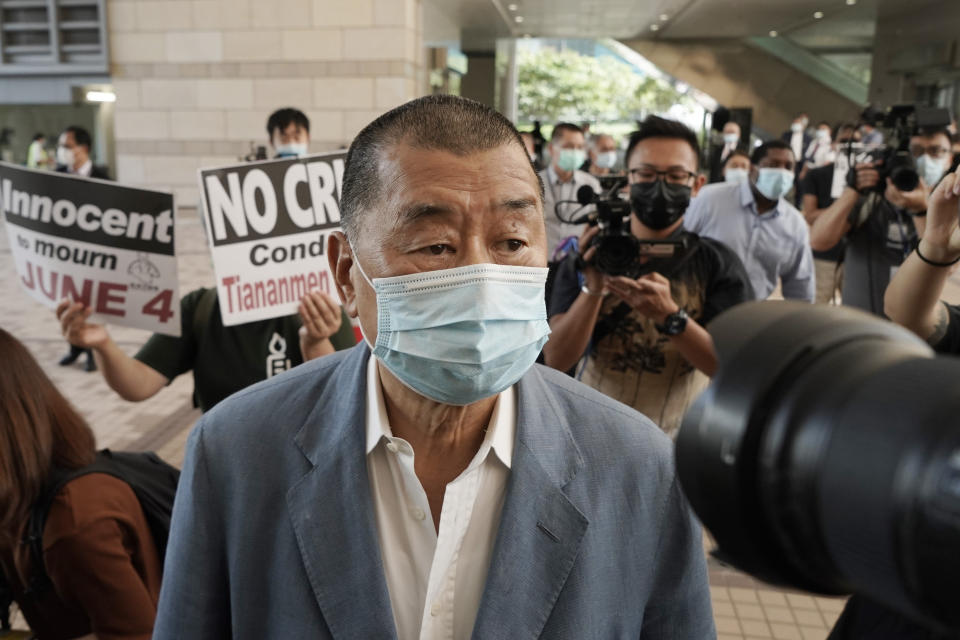 In this Thursday, Oct. 15, 2020 photo, Jimmy Lai arrives at a court in Hong Kong. Jimmy Lai, the pro-democracy Hong Kong media tycoon who was arrested during a crackdown on dissent was charged Wednesday Dec. 2, 2020, with fraud but no national security offenses, two newspapers reported. Jimmy Lai of Next Digital, which owns the Apple Daily newspaper, was among 10 people arrested Aug. 10 on what police said was suspicion of violating a national security law and collusion with a foreign country. Lai, 71, was later released on bail but police raided his company's offices in October. (AP Photo/Kin Cheung)