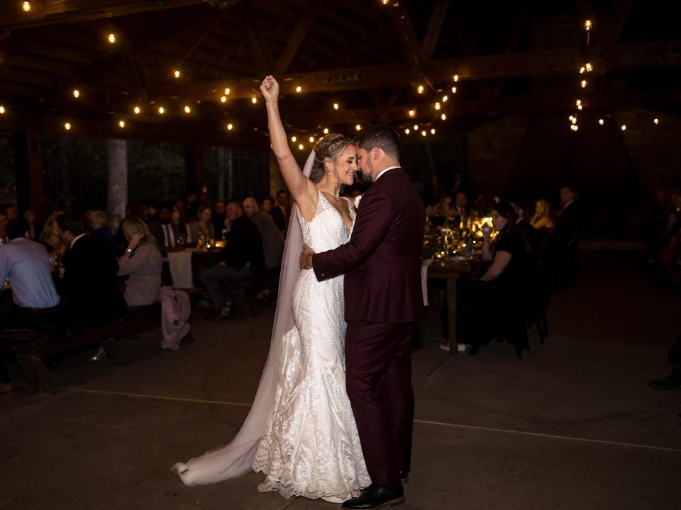 dance between bride and groom at campground wedding