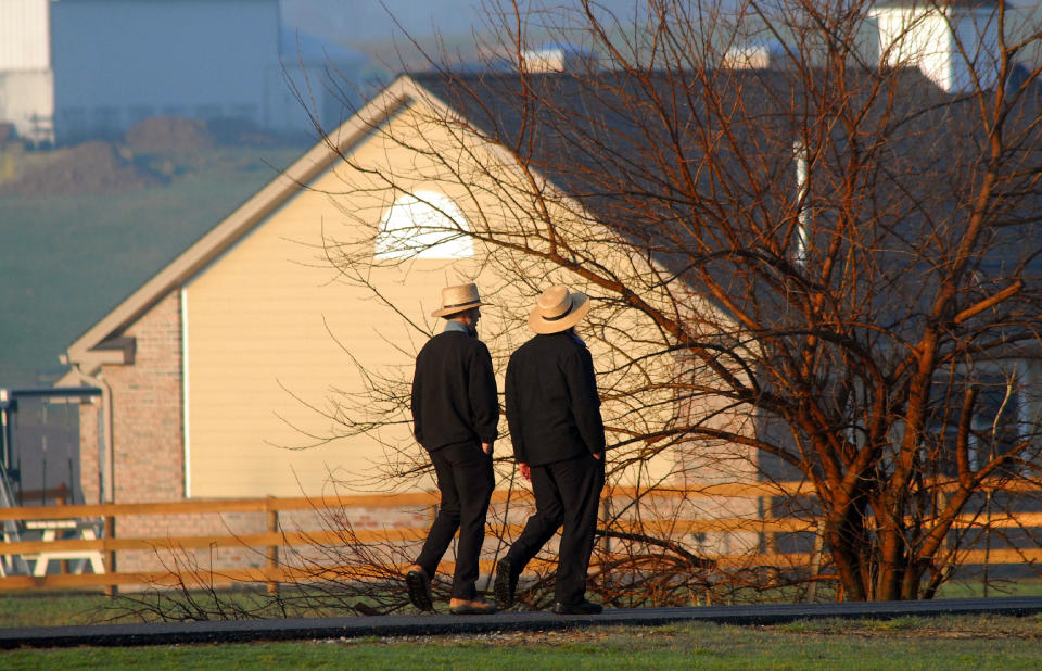 Amish men pass the newly built schoolhouse April 2, 2007 in Nickel Mines, Pennsylvania. (Photo: William Thomas Cain via Getty Images)