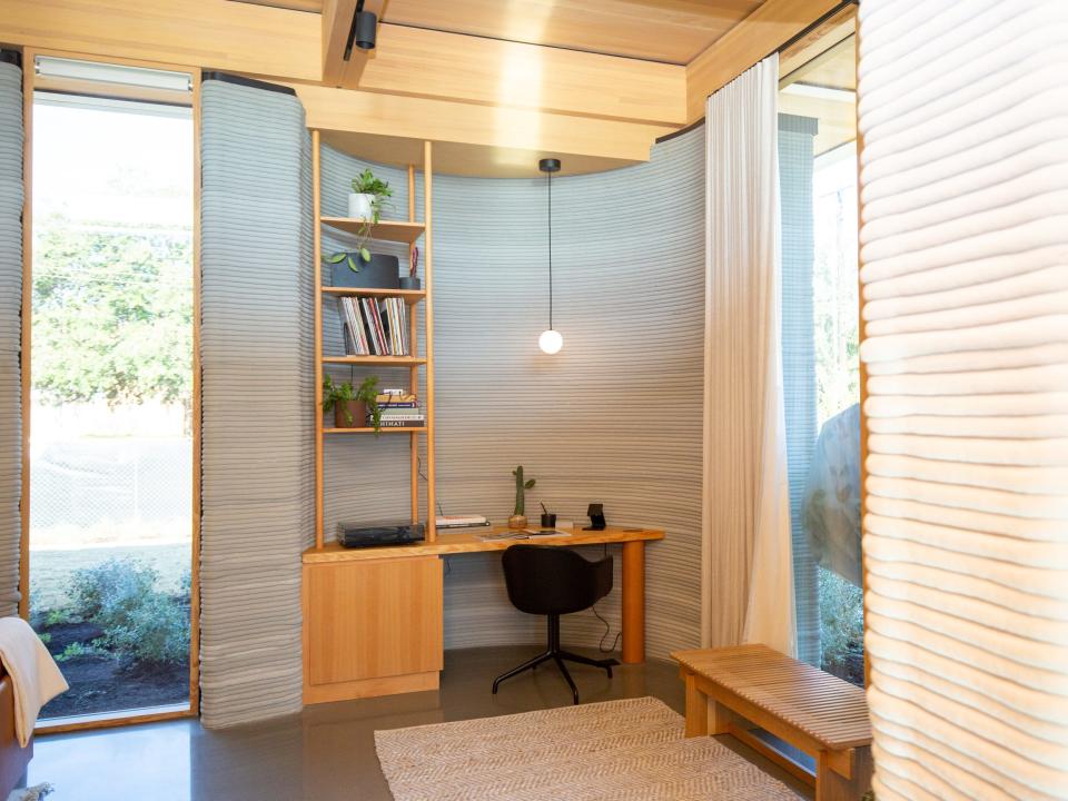 Inside Icon's over 2,000-square-foot House Zero in Austin. There's a desk space with a desk, light, chair.